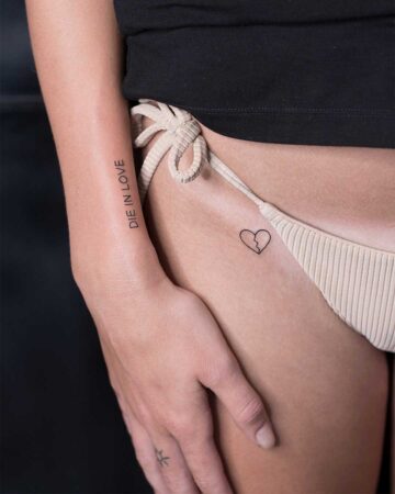 Arm tattoo "Die in Love" and bikini heart tattoo design Done by tattoo artists in our fine line tattoo studio parlour shop Canggu, Bali