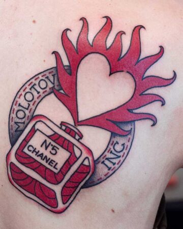 black and red tattoo on shoulder blade Molotov cocktail heart fire Chanel No. 5
