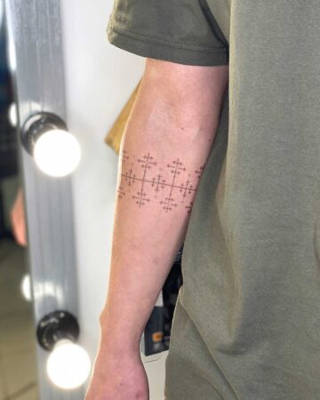 black and white tattoo on the arm on the wrist thin lines flower of life pattern ornament Slavic bracelet around the arm
