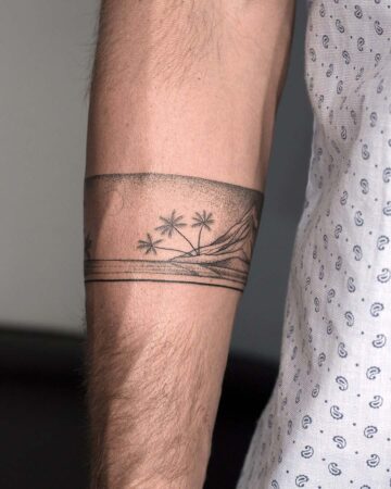Arm tattoo with palm trees and horizon design Done by tattoo artists in our fine line tattoo studio parlour shop Canggu, Bali