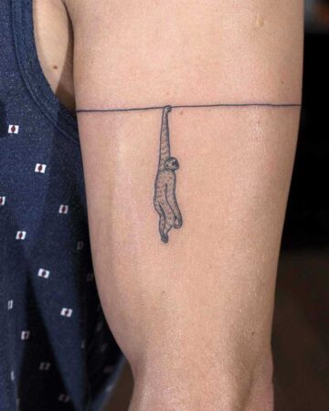 black and white mini tattoo graphics minimalism dowork on the arm on the shoulder sloth and a bracelet with a thin line
