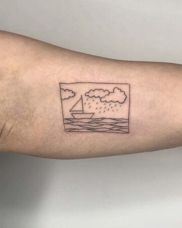 Line art sailboat tattoo on forearm with clouds and waves Done by tattoo artists in our fine line tattoo studio parlour shop Canggu, Bali
