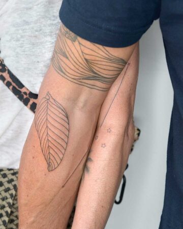 minimalistic tattoo matching line geometry