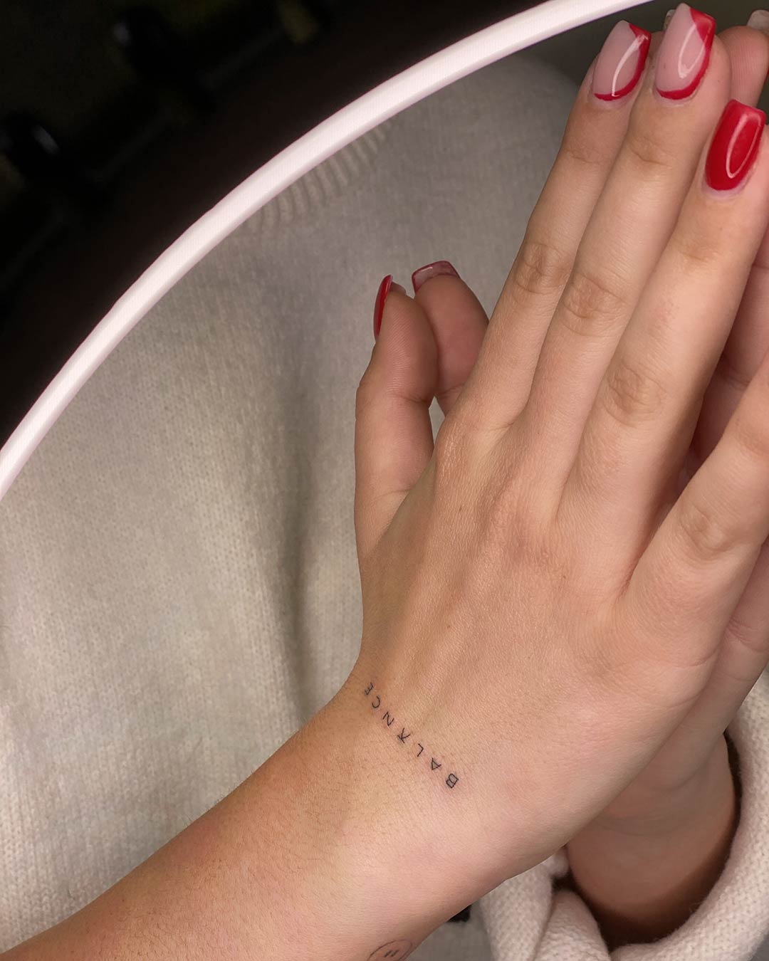 tattoo script lettering on the arm balance tiny fine line single needle