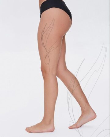 Person with tattoo design on leg wearing black underwear Done by tattoo artists in our fine line tattoo studio parlour shop Canggu, Bali