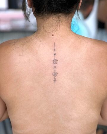 tattoo ornament fine line black single needle minimalistic on the back floral sun star dots bali canggu turtle lotus unalome