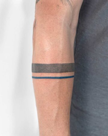 black and white tattoo bracelet of two lines on the arm on the forearm minimalism geometry dotwork