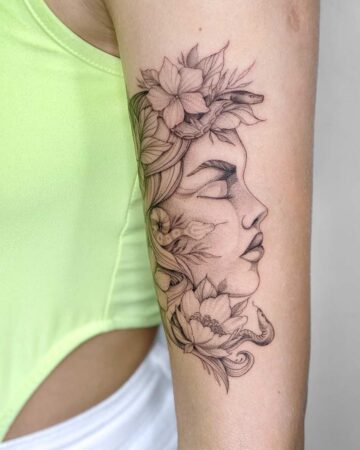 black and white tattoo on the arm for girls female fine lines graphics a girl's face in profile with flowers on her head and snakes