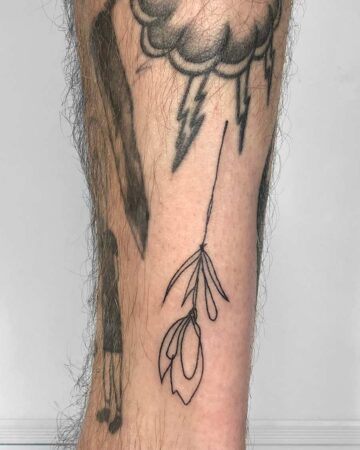 black and white tattoo on the leg fine lines abstract lines minimalism mini flower rose flower