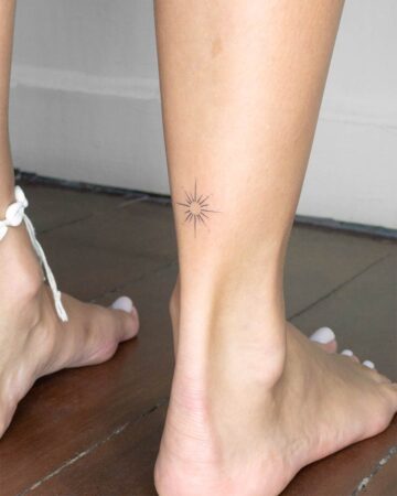 fine line star minimalist geometry tattoo on the ancle by our artists in fine line tattoo studio Canggu Bali