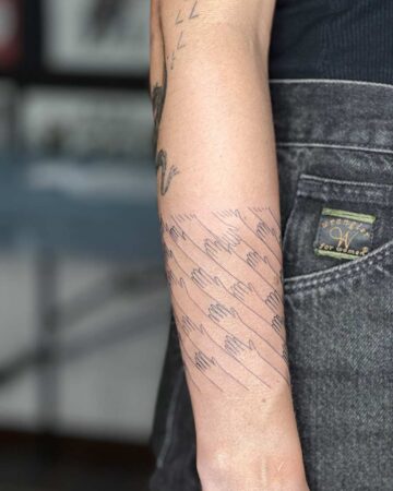 Forearm with lined heart tattoo design in tattoo studio Done by tattoo artists in our fine line tattoo studio parlour shop Canggu, Bali