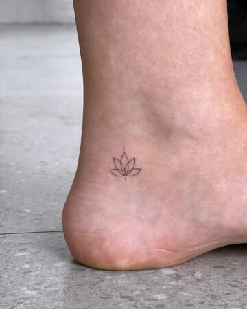 Minimalist lotus flower ankle tattoo with small dots. Simple and elegant. By tattoo artists in tattoo studio Canggu, Bali