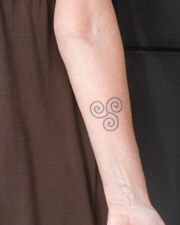 Minimalist spiral tattoo on arm by our artists in fine line tattoo studio Canggu Bali