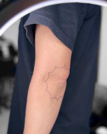 tattoo black minimalistic figure star on the hand around elbow fineline