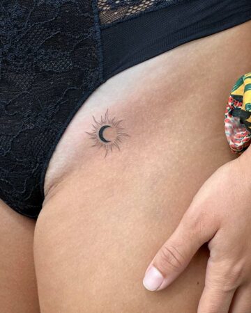 tattoo fineline sun moon on the thigh woman thin line fine line black single needle minimalistic tiny