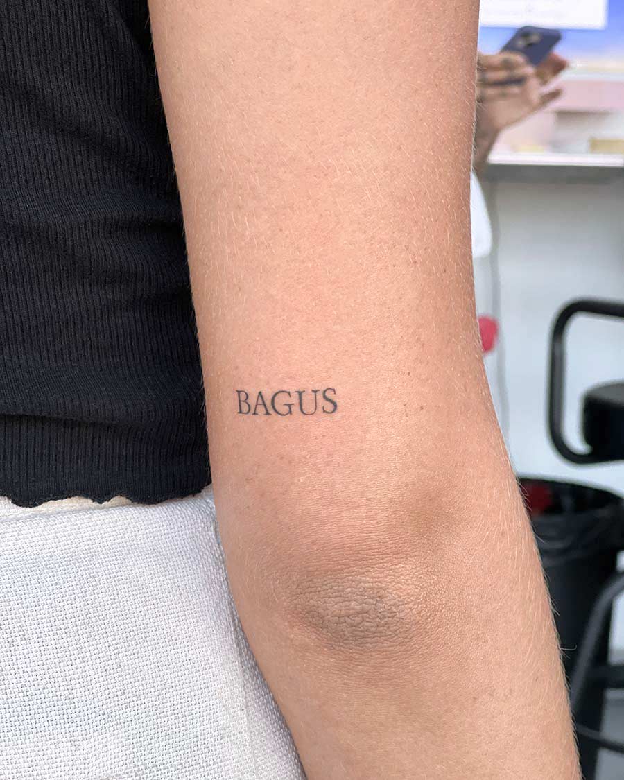 tattoo script lettering on the arm fineline bagus