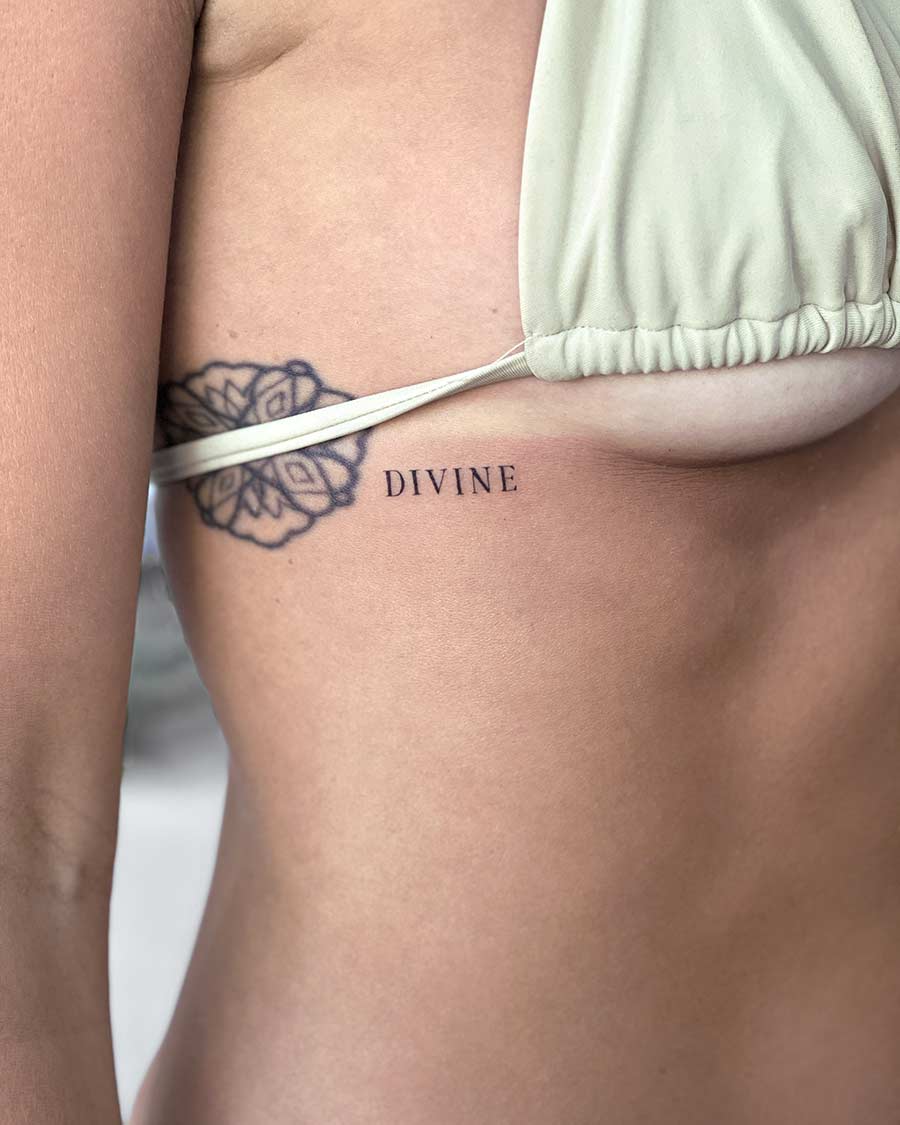 tattoo script lettering on the side reebs fineline black divine