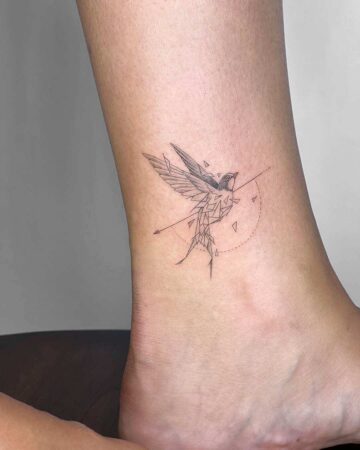 tattoo swallow on the leg fineline black singleneedle geometry minimalistic
