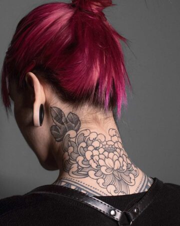 a detailed black and grey floral chrysanthemums oriental japanese black and grey ink tattoo covering the back of their neck.