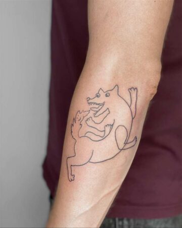 A unique line art dog tattoo on an arm, depicting two playful dogs in a whimsical, abstract style. A fun dog tattoo idea. Created by the best tattoo artists in Canggu Bali.